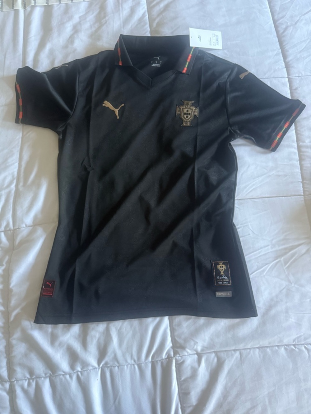 Puma Black Portugal Football Jersey with Gold and Red-Green Trim